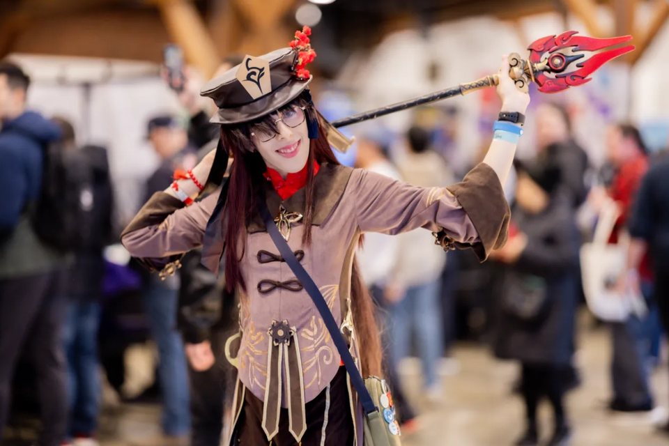 Cosplayer posing on the expo floor for the Cosplay Catwalk